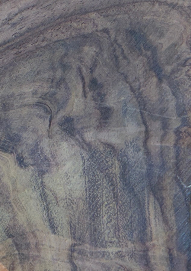 A close-up of a textured surface with marbled or veined patterns in muted blue-gray, gray, beige, and brown tones.