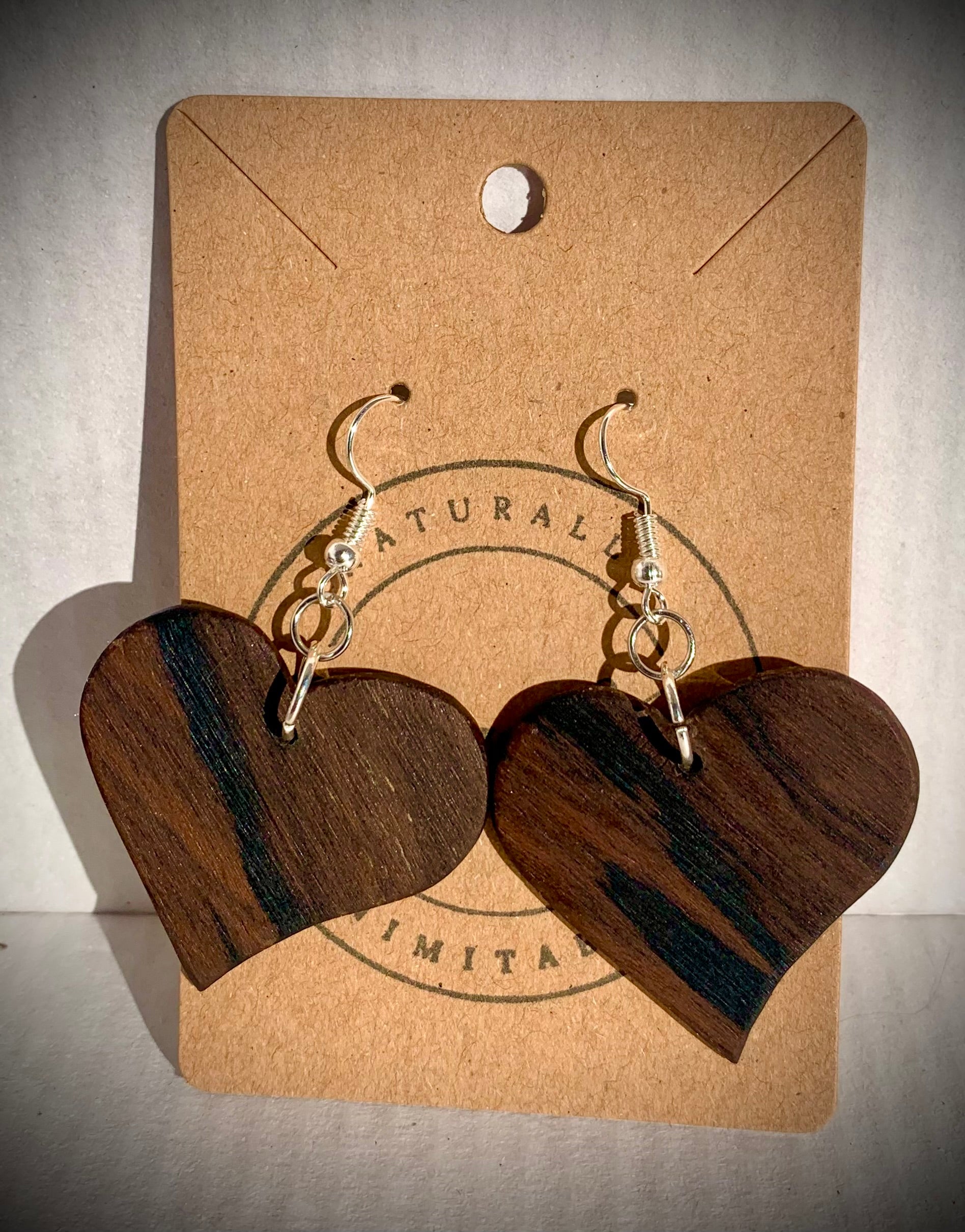 Dark wooden heart shaped earrings.